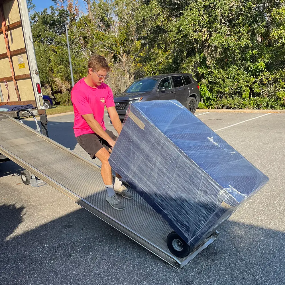 beach bod moving team pulling dolley